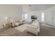 Bright living room featuring neutral paint, plush seating, and large windows with blinds at 3313 E Waltann Ln, Phoenix, AZ 85032