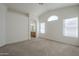 Large bedroom featuring a vaulted ceiling and view into the en suite bathroom at 3313 E Waltann Ln, Phoenix, AZ 85032