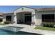 Relaxing backyard pool area with a covered patio, comfortable seating, and well-manicured landscaping, perfect for outdoor living at 3675 E Strawberry Dr, Gilbert, AZ 85298