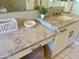 A bathroom vanity featuring marble countertops, white cabinetry, and brushed nickel hardware at 3675 E Strawberry Dr, Gilbert, AZ 85298