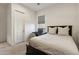 Cozy bedroom featuring neutral walls, carpeted floor, ceiling fan, and bright window at 3675 E Strawberry Dr, Gilbert, AZ 85298