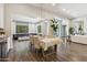 Inviting dining room with hardwood floors, stylish furnishings, and seamless flow to the living spaces at 3675 E Strawberry Dr, Gilbert, AZ 85298