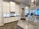 Modern kitchen island featuring a gray countertop and stainless steel appliances and hardware at 3675 E Strawberry Dr, Gilbert, AZ 85298