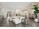 Spacious living room with modern finishes, a large sectional sofa, and an open floor plan to the kitchen at 3675 E Strawberry Dr, Gilbert, AZ 85298