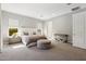 Spacious main bedroom featuring ample natural light, neutral color scheme, and contemporary furnishings at 3675 E Strawberry Dr, Gilbert, AZ 85298