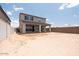 Expansive backyard featuring a covered patio, perfect for outdoor entertaining and relaxation at 40218 N Alegre Dr, San Tan Valley, AZ 85140
