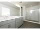 Modern bathroom featuring large vanity, walk-in shower, and neutral decor at 40218 N Alegre Dr, San Tan Valley, AZ 85140