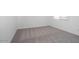 A well-lit bedroom offers neutral carpeting and white walls, creating a clean and modern aesthetic at 40218 N Alegre Dr, San Tan Valley, AZ 85140