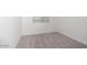 A well-lit bedroom offers neutral carpeting and white walls, creating a clean and modern aesthetic at 40218 N Alegre Dr, San Tan Valley, AZ 85140