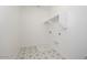 Neat laundry room with stylish tiled floors at 40218 N Alegre Dr, San Tan Valley, AZ 85140