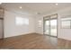 Bright room featuring tile floors, large windows, and a sliding glass door to the outside at 40218 N Alegre Dr, San Tan Valley, AZ 85140