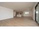 Open-concept living space connects seamlessly with the modern kitchen and backyard access at 40218 N Alegre Dr, San Tan Valley, AZ 85140