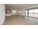 Spacious living room featuring tile flooring, recessed lighting, and access to the backyard at 40218 N Alegre Dr, San Tan Valley, AZ 85140