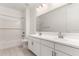 Modern bathroom featuring double sinks, a large mirror, and a combined bathtub and shower at 40531 W Michaels Dr, Maricopa, AZ 85138