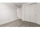 Bedroom features neutral carpet, double door closet and white walls offering a peaceful space at 40531 W Michaels Dr, Maricopa, AZ 85138