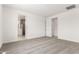 A bedroom with neutral carpet offering doorways to the bathroom and closet at 40531 W Michaels Dr, Maricopa, AZ 85138