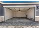 Spacious garage featuring high ceilings and ample room for vehicles and storage at 40531 W Michaels Dr, Maricopa, AZ 85138