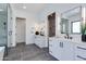 Luxurious main bathroom featuring double vanities and a glass-enclosed shower at 4302 E Marion Way, Phoenix, AZ 85018