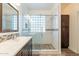 Beautiful bathroom featuring a double vanity and glass shower at 44383 W Windrose Dr, Maricopa, AZ 85138