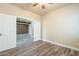 Bright, light-filled bedroom features attractive floors and neutral paint palette at 44383 W Windrose Dr, Maricopa, AZ 85138