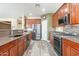 Spacious kitchen with stainless steel appliances and attractive, modern cabinetry at 44383 W Windrose Dr, Maricopa, AZ 85138