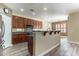 Spacious kitchen with granite countertops, a kitchen island, and stainless steel appliances at 44383 W Windrose Dr, Maricopa, AZ 85138