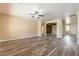 Expansive living room featuring modern floors and a neutral color palette throughout at 44383 W Windrose Dr, Maricopa, AZ 85138