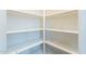 Walk-in pantry with several shelves for ample storage at 44383 W Windrose Dr, Maricopa, AZ 85138