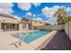 Refreshing backyard pool with well-kept landscaping and neighborhood views at 44383 W Windrose Dr, Maricopa, AZ 85138