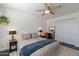 Well-lit bedroom featuring a queen-size bed, side tables with lamps, and a closet at 4832 E Mineral Rd # 5, Phoenix, AZ 85044