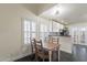 Cozy dining area with wood table and bright windows and access to the kitchen at 4832 E Mineral Rd # 5, Phoenix, AZ 85044