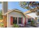 Inviting single story home with light blue siding, red shutters and front porch seating at 4832 E Mineral Rd # 5, Phoenix, AZ 85044