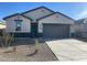 Charming single-story home featuring a spacious driveway and low-maintenance landscaping at 493 W Freedom St, Florence, AZ 85132