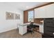 Well-lit office space featuring built-in cabinets, a large desk, and neutral carpeting at 514 W Freedom St, Florence, AZ 85132