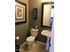 Powder room with a toilet, a pedestal sink, a framed art, and neutral paint colors at 5426 E Calle De Baca --, Cave Creek, AZ 85331