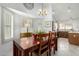 Bright dining room features a window and flows into the kitchen at 5658 E Fairbrook St, Mesa, AZ 85205