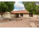 Charming single-story home features desert landscaping and a red tile roof at 5658 E Fairbrook St, Mesa, AZ 85205