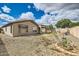 The backyard is spacious and has an ample supply of rocks and plenty of sunshine at 6198 W Wikieup Ln, Glendale, AZ 85308