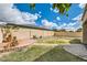 Enjoy this serene backyard with lush grass, beautiful landscaping and a high block fence at 6198 W Wikieup Ln, Glendale, AZ 85308