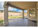 A covered patio with a tiled floor overlooks the private backyard, great for outdoor living at 6198 W Wikieup Ln, Glendale, AZ 85308