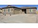 Charming single-story home with a well-maintained front yard and a spacious concrete driveway at 634 W Pintail Dr, Casa Grande, AZ 85122