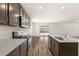 Modern kitchen showcasing stainless steel appliances, granite countertops, and a view to the backyard at 634 W Pintail Dr, Casa Grande, AZ 85122