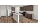 Kitchen with stainless steel appliances, granite countertops, and a central island with a sink at 634 W Pintail Dr, Casa Grande, AZ 85122