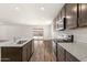 Spacious kitchen featuring stainless steel appliances, a center island and backyard access at 635 W Pintail Dr, Casa Grande, AZ 85122