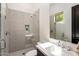 Well-lit bathroom featuring a walk-in shower with decorative tile and a modern sink vanity at 6650 N Hillside Dr, Paradise Valley, AZ 85253