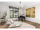 Elegant living room featuring a piano, large window, and modern decor at 6650 N Hillside Dr, Paradise Valley, AZ 85253