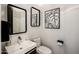 Stylish powder room with a sleek sink, modern mirrors, and contemporary art at 6650 N Hillside Dr, Paradise Valley, AZ 85253