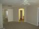 Empty bedroom featuring neutral walls and carpets, as well as a ceiling fan at 6656 S Classic Way, Gilbert, AZ 85298