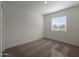 Cozy bedroom featuring neutral carpeting, a window with blinds, and base molding at 666 W Pintail Dr, Casa Grande, AZ 85122