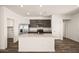 Bright kitchen with a granite island, stainless steel appliances, and ample cabinet space at 666 W Pintail Dr, Casa Grande, AZ 85122